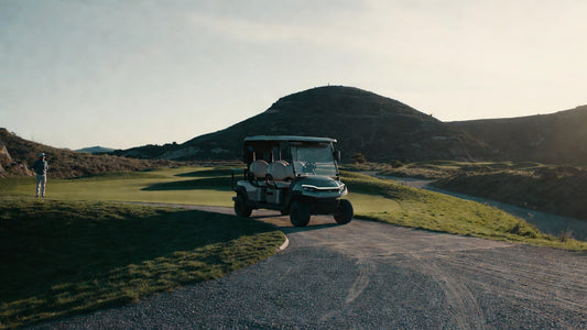 Professional golf cart test drive on a golf course featuring hills, rough terrain, and tight corners for fleet evaluation.