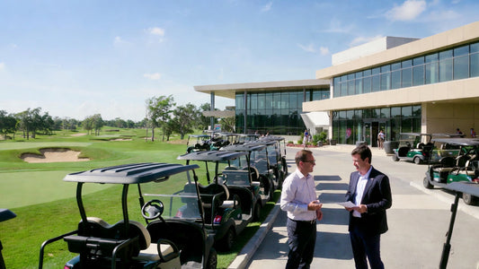Golf cart fleet outside a clubhouse with a buyer reviewing a contract, representing professional purchasing decisions and contract awareness.
