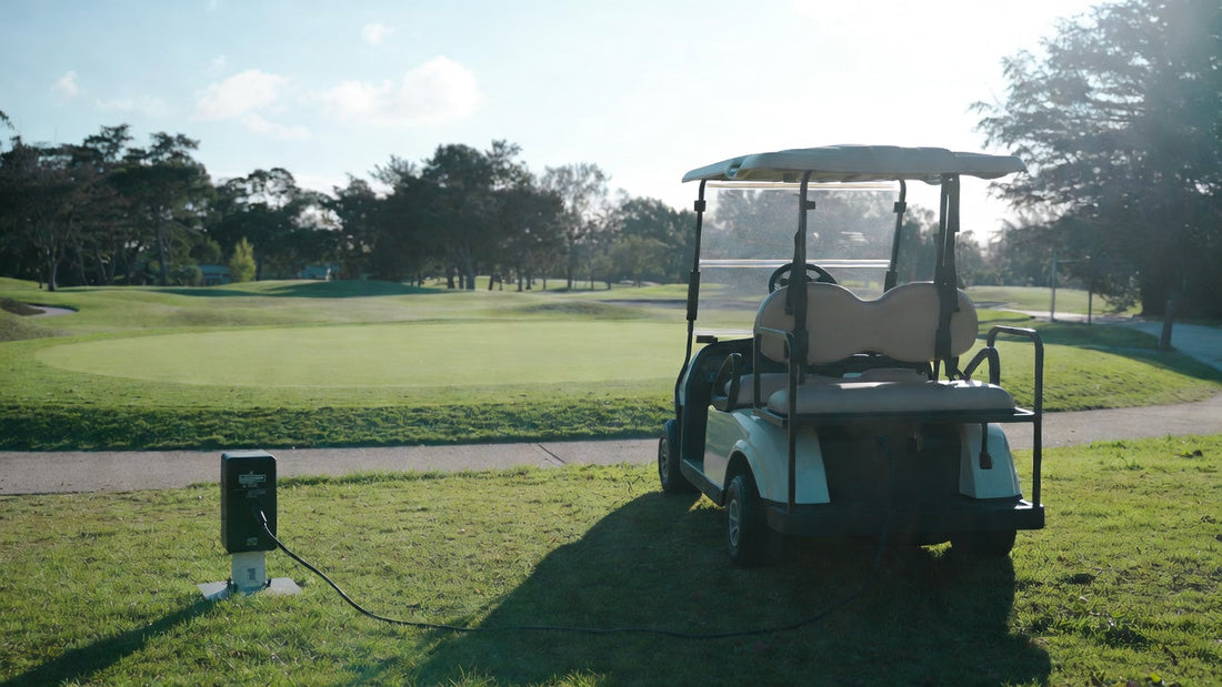 Golf cart parked for storage with battery being charged, illustrating proper off-season maintenance.