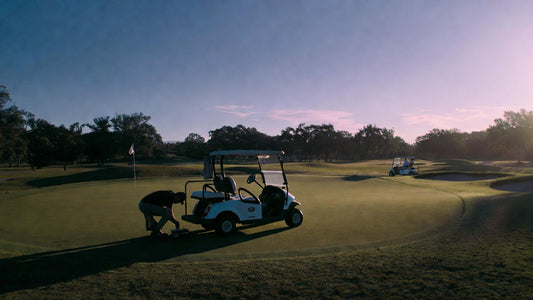 Golf cart breakdown on a golf course illustrating the hidden cost of fleet downtime and operational disruption.