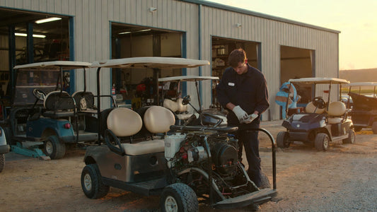 Veteran golf cart technician in a service bay, revealing the real-world perspective behind fleet durability decisions.