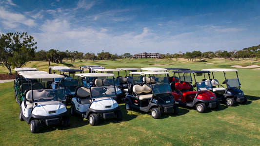 Golf carts from top brands parked on a premium golf course, representing durability and high resale value.