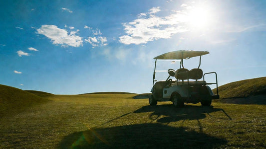 Golf cart overheating on a hot summer course with early smoke warning signs, highlighting fire risk and safety awareness.