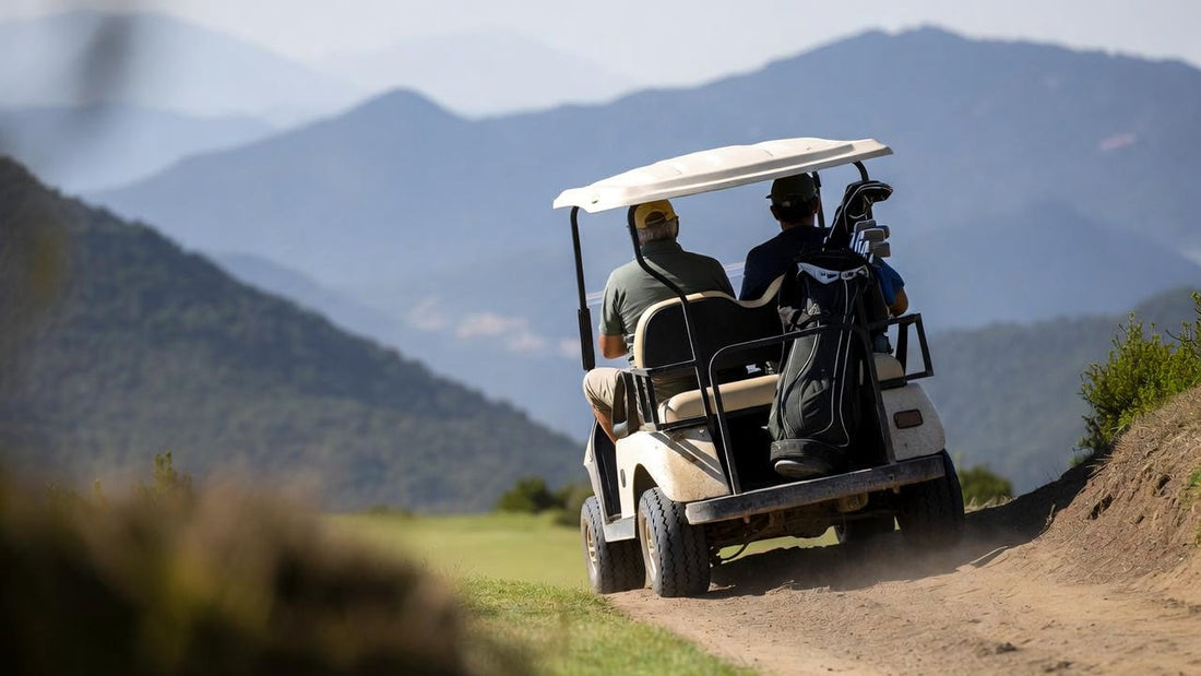 Single golf cart climbing a steep mountain course hill, highlighting load stress, incline challenge, and real-world hill-climb performance.