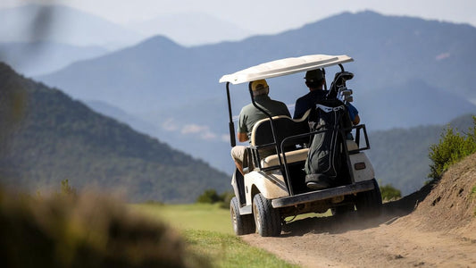 Single golf cart climbing a steep mountain course hill, highlighting load stress, incline challenge, and real-world hill-climb performance.