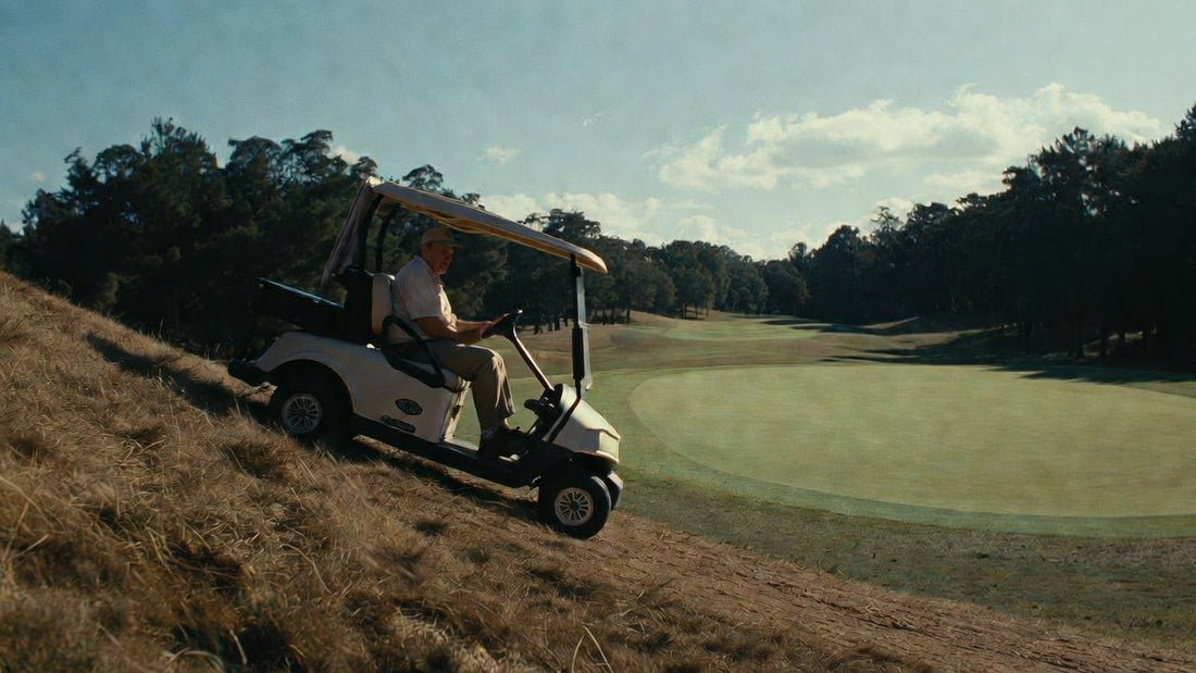 Golf cart struggling uphill on a course, illustrating common power issues and maintenance challenges.